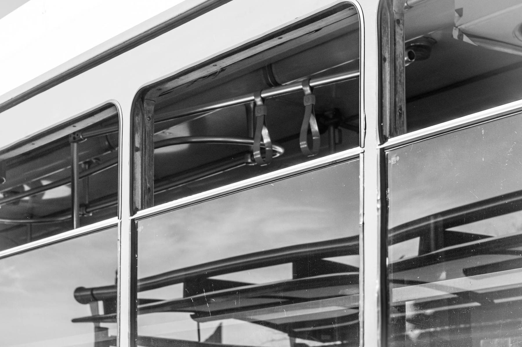 Public transport bus on an Auckland city street with passengers boarding